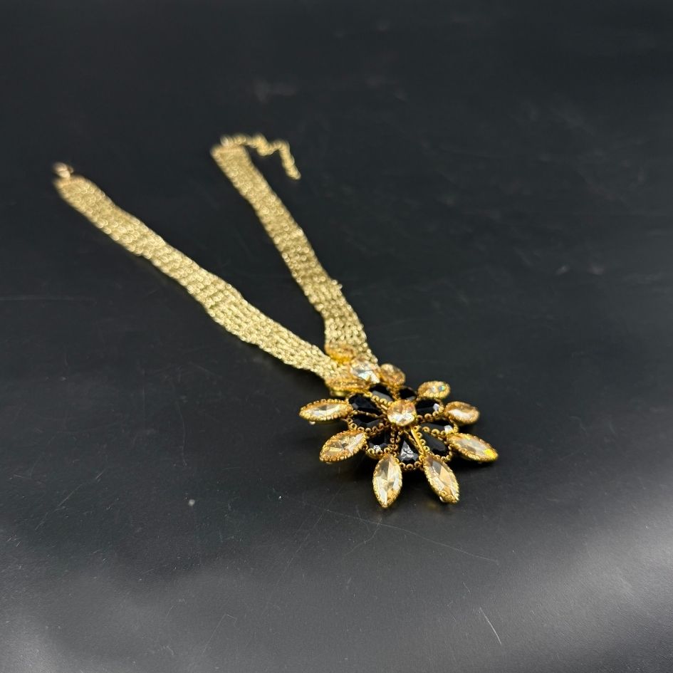 Parure collier et boucles d’oreilles dorée noire avec cristaux champagne