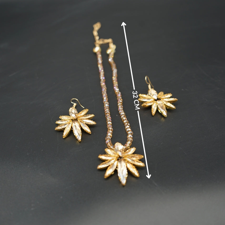 Collier et boucles d’oreilles étoile dorée pour cérémonie ou soirée
