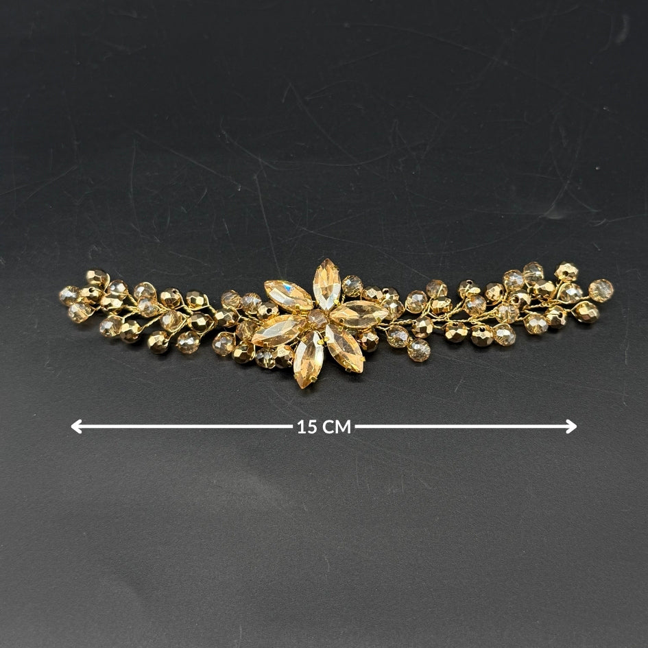 Petit broche doré motif fleur