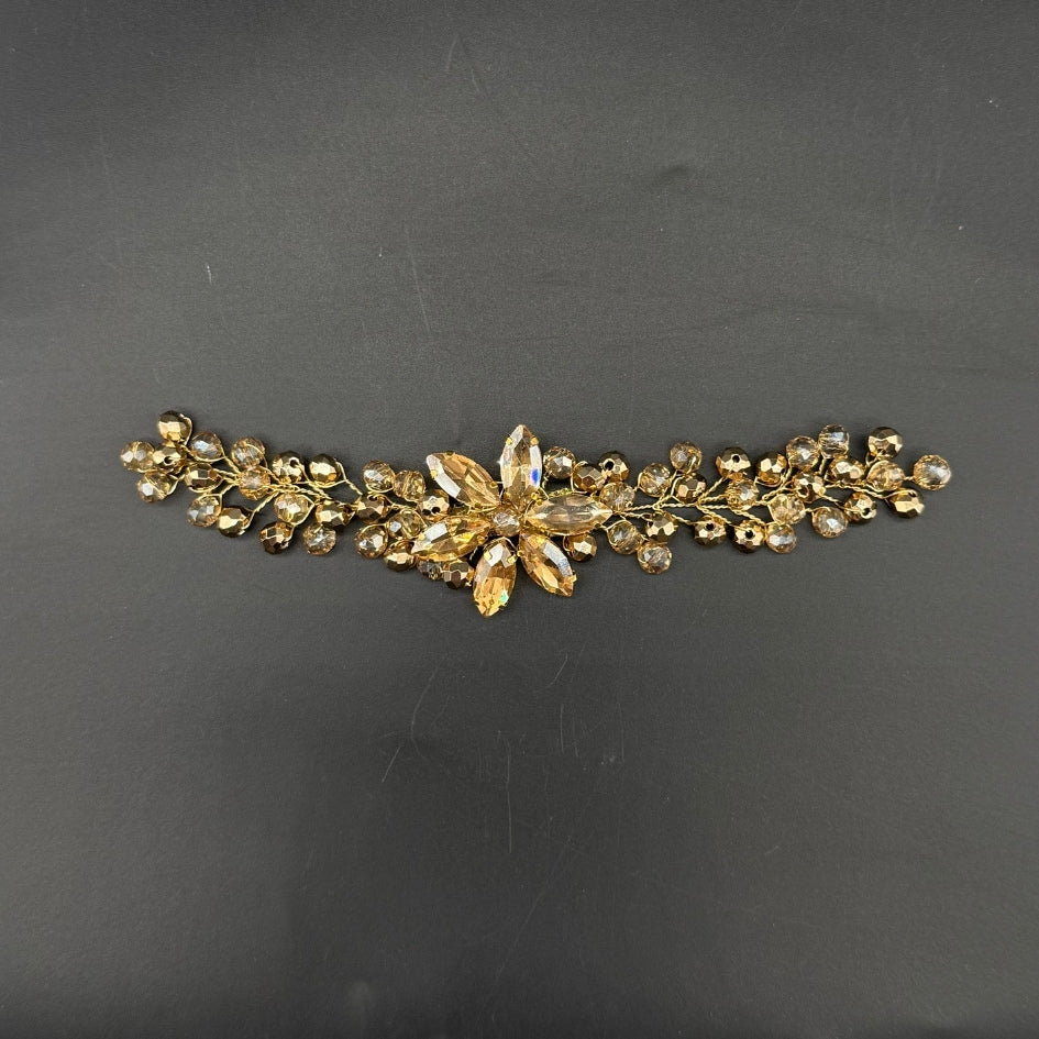 Petit broche doré motif fleur