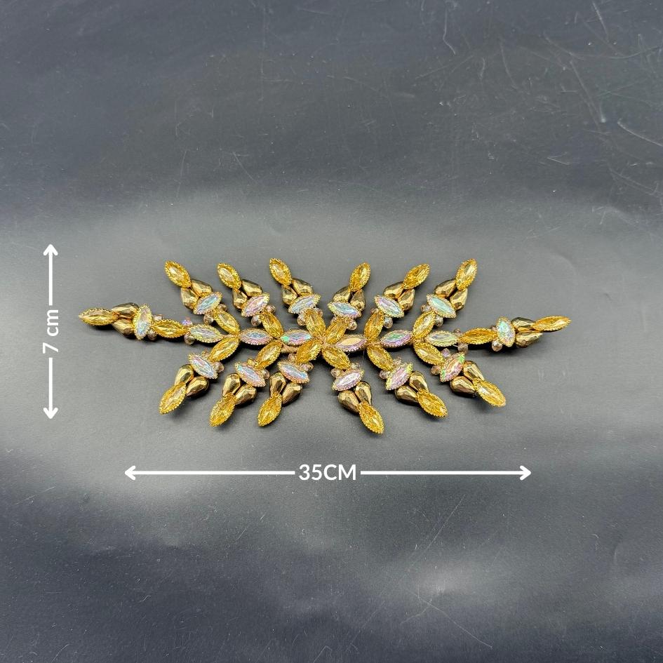 Broche dorée pierres scintillantes