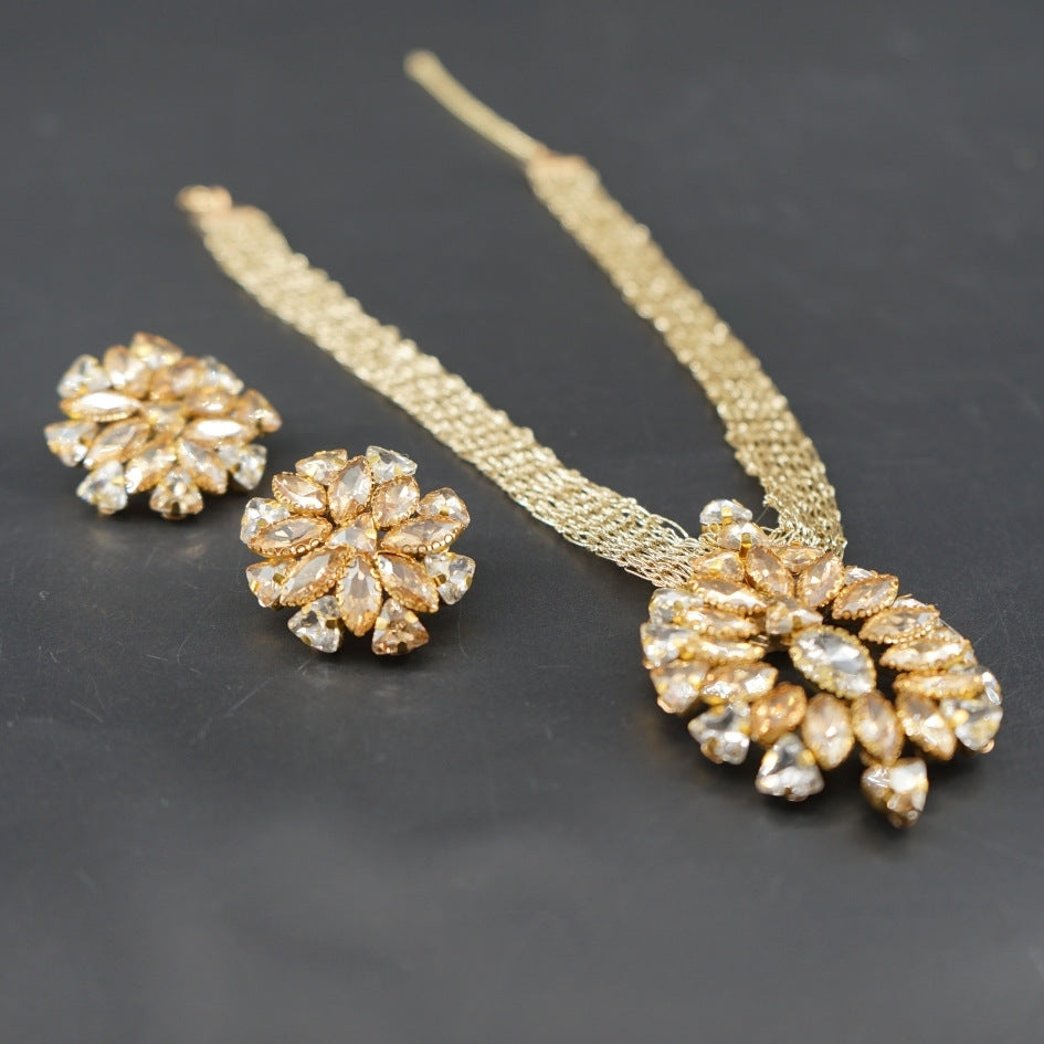 Collier doré cristaux champagne luxe