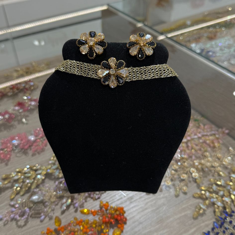 Parure collier choker et boucles d’oreilles dorée noire avec cristaux champagne