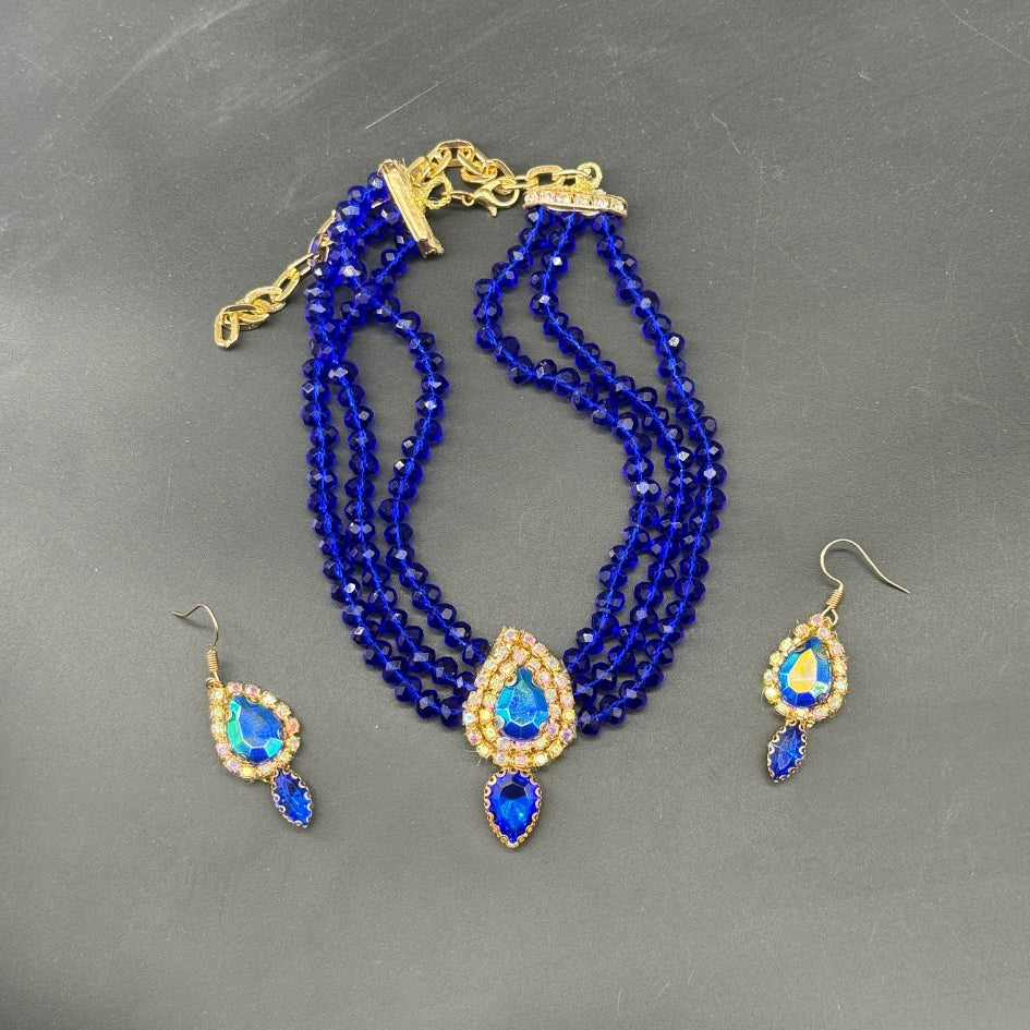 Collier et boucles d’oreilles étoile dorée pour cérémonie bleu roi