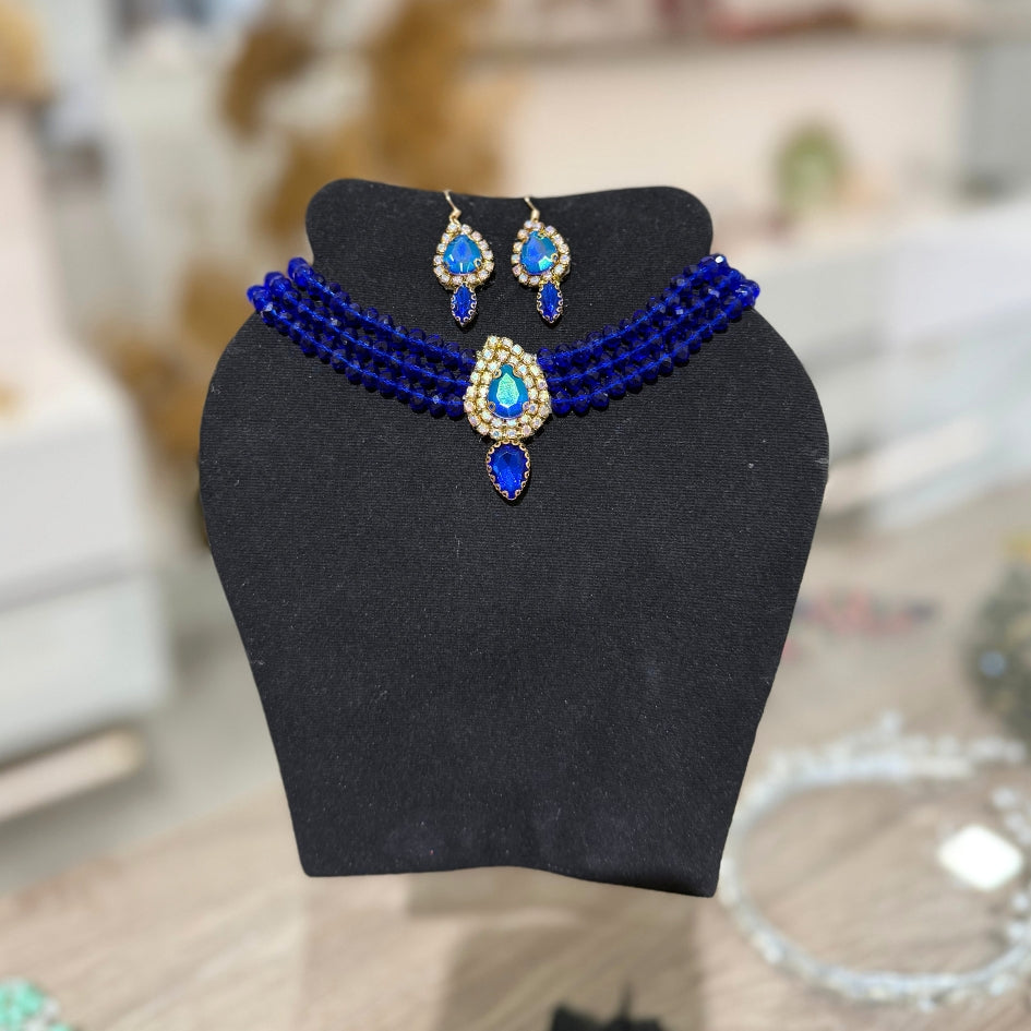 Collier et boucles d’oreilles étoile dorée pour cérémonie bleu roi